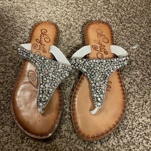 Maury monkey flip flops with jewels on the front
